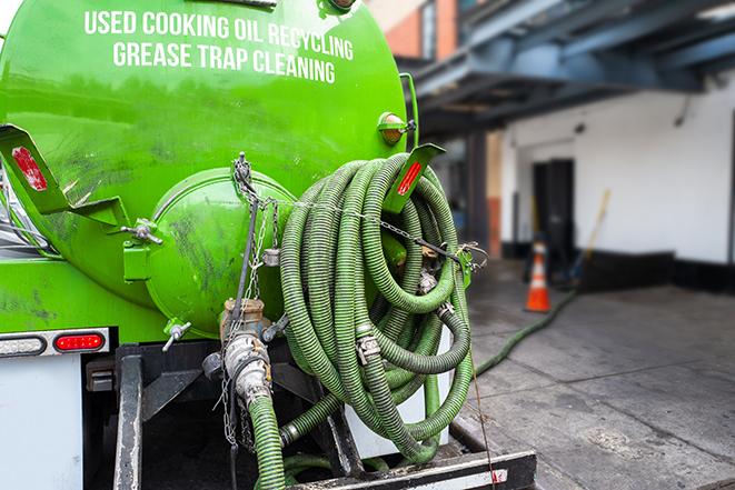 grease trap pumping equipment in action in Mineral Ridge, OH